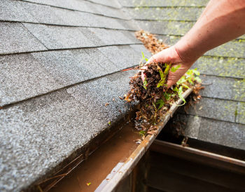 Cleaning gutters before storm season